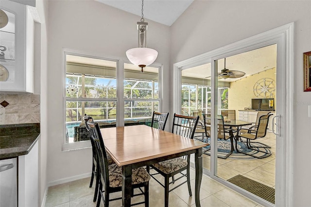 4733 Spring Meadow Ln, Sarasota, FL 34233 - dining space with light tile patterned floors and a ceiling fan