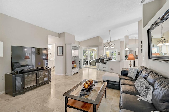 4733 Spring Meadow Ln, Sarasota, FL 34233 - living room with vaulted ceiling and light tile patterned floors