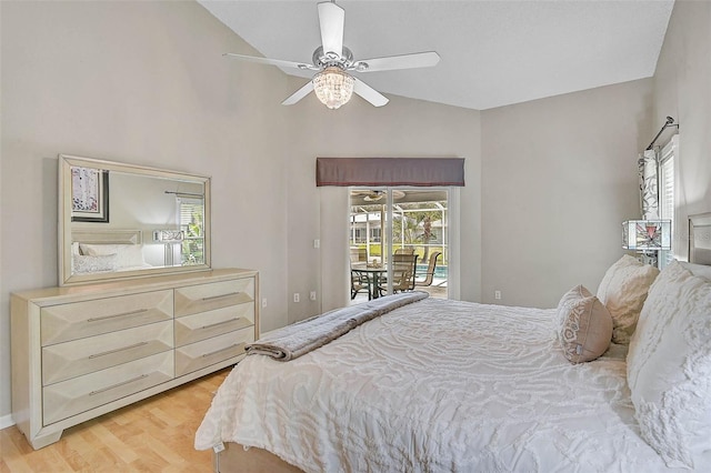 4733 Spring Meadow Ln, Sarasota, FL 34233 - bedroom featuring access to outside, multiple windows, light wood-style flooring, lofted ceiling, and ceiling fan
