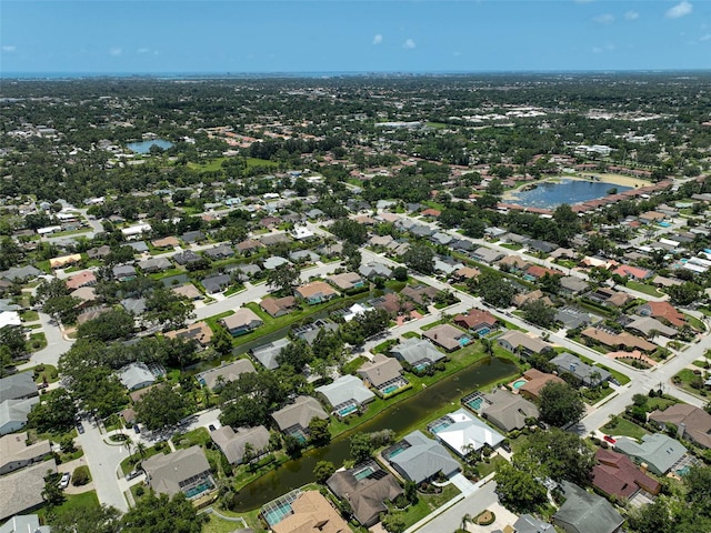 4733 Spring Meadow Ln, Sarasota, FL 34233 - aerial overview of property's location featuring a nearby body of water and nearby suburban area