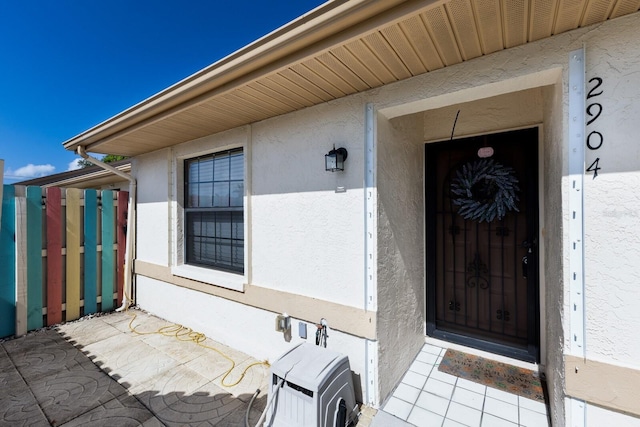 2904 64th St W Unit 2904, Bradenton, FL 34209 - doorway to property featuring stucco siding