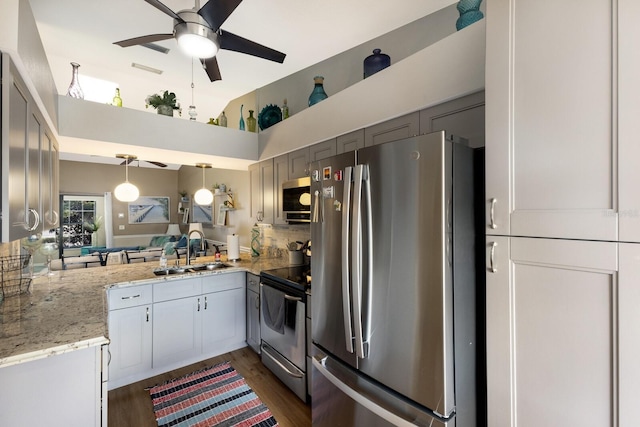 2904 64th St W Unit 2904, Bradenton, FL 34209 - kitchen featuring stainless steel appliances, a ceiling fan, high vaulted ceiling, dark wood-style flooring, and decorative light fixtures