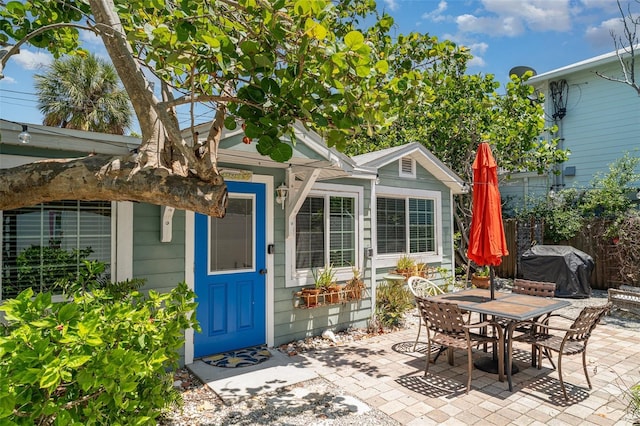 509 Pine Ave Unit A, Anna Maria, FL 34216 - view of patio / terrace featuring a grill and outdoor dining space