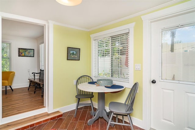 509 Pine Ave Unit A, Anna Maria, FL 34216 - dining space featuring dark wood-style flooring and ornamental molding