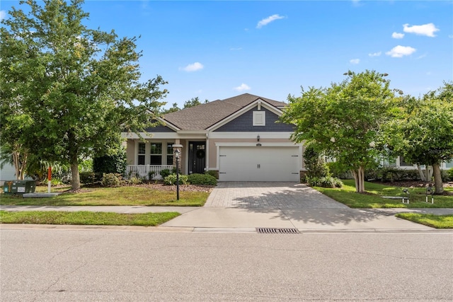 11434 Spring Gate Trl, Bradenton, FL 34211 - view of front of house with driveway, an attached garage, a front yard, and a porch