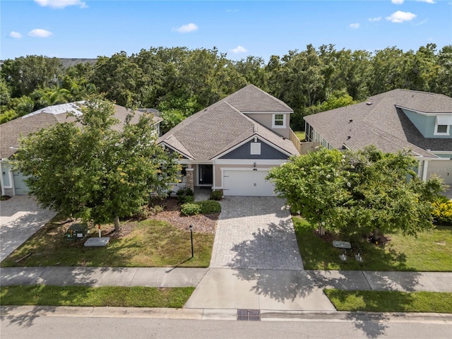 11434 Spring Gate Trl, Bradenton, FL 34211 - view of front of home featuring decorative driveway, a garage, and a front yard