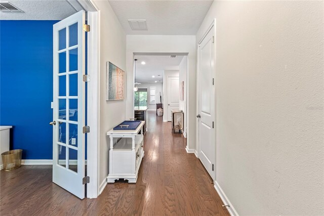 11434 Spring Gate Trl, Bradenton, FL 34211 - hall featuring dark wood-style flooring and baseboards
