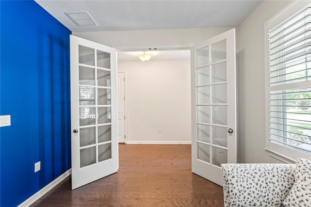 11434 Spring Gate Trl, Bradenton, FL 34211 - hallway featuring french doors and wood finished floors