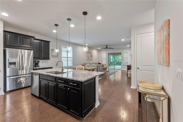 11434 Spring Gate Trl, Bradenton, FL 34211 - kitchen featuring stainless steel appliances, dark cabinets, dark wood-style floors, and recessed lighting