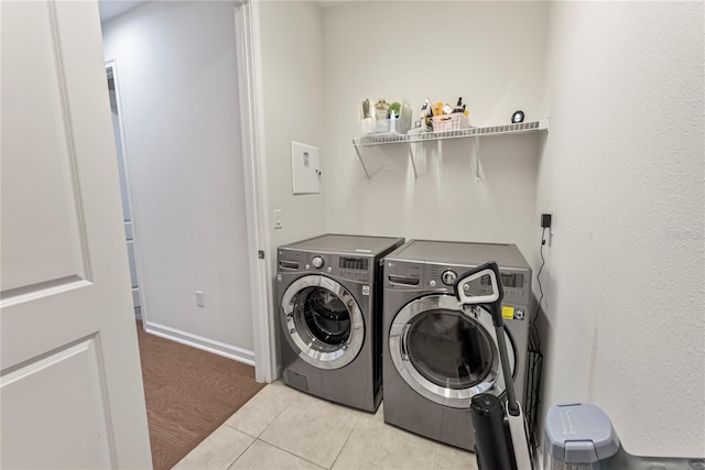 11434 Spring Gate Trl, Bradenton, FL 34211 - laundry room with washer and clothes dryer and light tile patterned floors