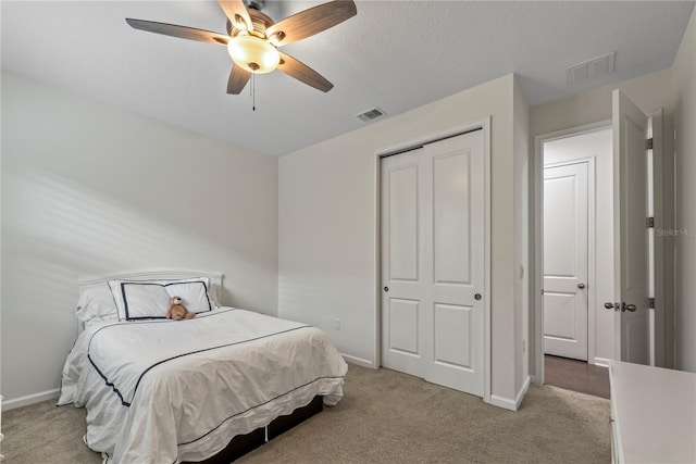 11434 Spring Gate Trl, Bradenton, FL 34211 - bedroom with light colored carpet, a closet, and ceiling fan