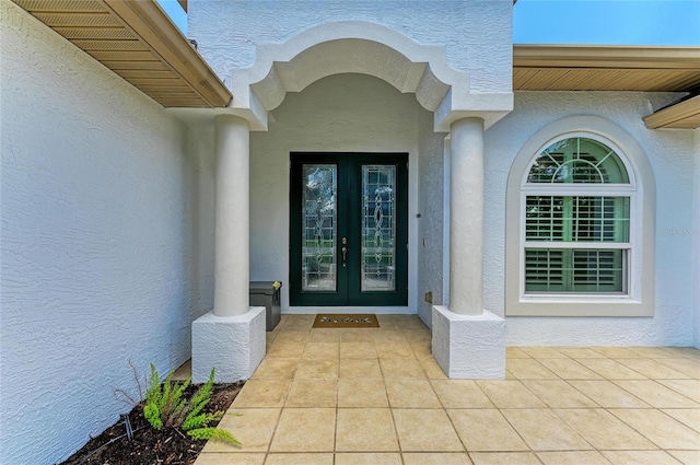 208 147th St NE, Bradenton, FL 34212 - property entrance featuring french doors and stucco siding