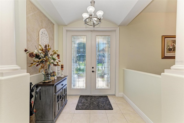 208 147th St NE, Bradenton, FL 34212 - foyer entrance featuring french doors, a chandelier, plenty of natural light, light tile patterned floors, and vaulted ceiling