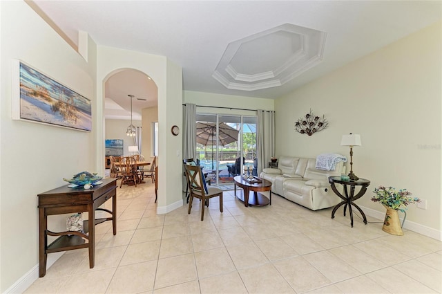 208 147th St NE, Bradenton, FL 34212 - living room featuring a raised ceiling, light tile patterned flooring, and arched walkways