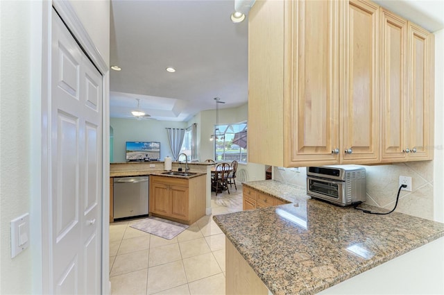 208 147th St NE, Bradenton, FL 34212 - kitchen with dishwasher, a peninsula, light stone countertops, light brown cabinetry, and recessed lighting