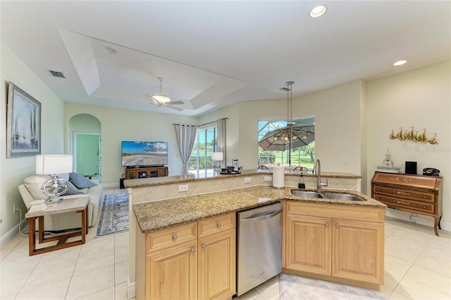 208 147th St NE, Bradenton, FL 34212 - kitchen featuring dishwasher, open floor plan, light stone counters, arched walkways, and a tray ceiling