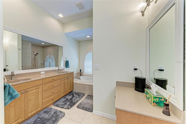 208 147th St NE, Bradenton, FL 34212 - bathroom with tile patterned floors, double vanity, a tile shower, and a bath