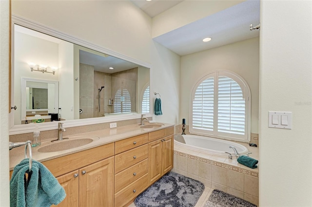 208 147th St NE, Bradenton, FL 34212 - full bathroom with a shower stall, double vanity, a garden tub, and tile patterned flooring