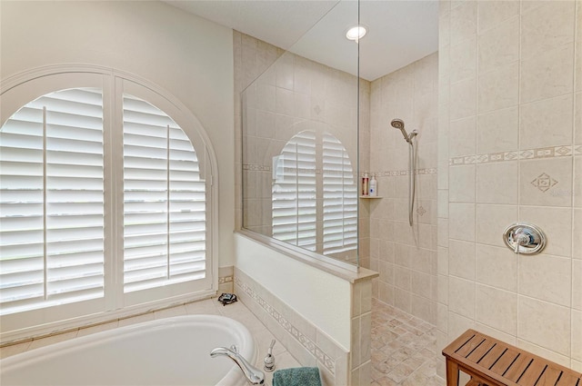 208 147th St NE, Bradenton, FL 34212 - bathroom featuring a walk in shower and a bath