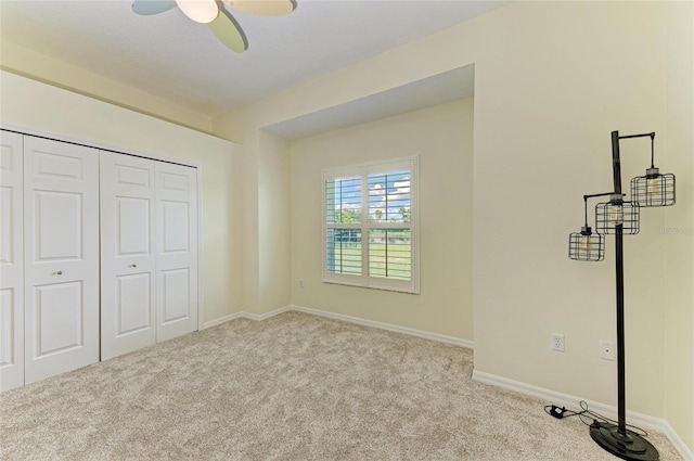 208 147th St NE, Bradenton, FL 34212 - unfurnished bedroom featuring carpet flooring, a closet, and a ceiling fan