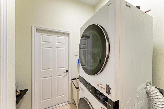 208 147th St NE, Bradenton, FL 34212 - laundry area with stacked washing machine and dryer and light tile patterned flooring