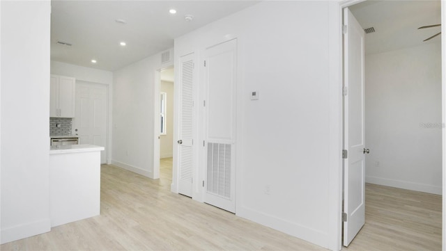 4796 Duncan Rd, Punta Gorda, FL 33982 - corridor featuring light wood-type flooring and recessed lighting