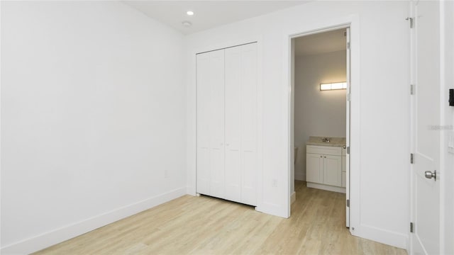 4796 Duncan Rd, Punta Gorda, FL 33982 - unfurnished bedroom featuring light wood-style flooring, a closet, and recessed lighting