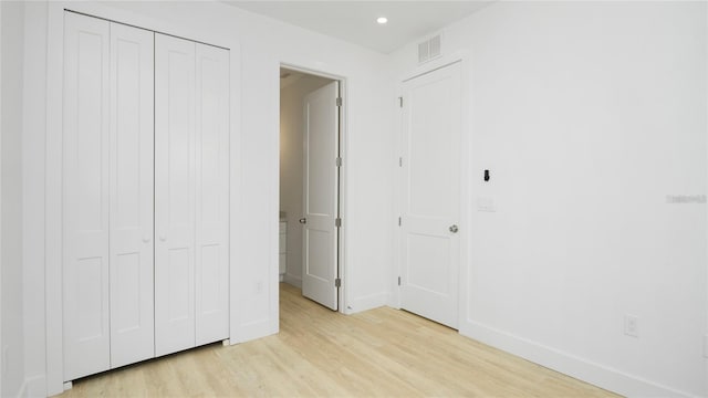 4796 Duncan Rd, Punta Gorda, FL 33982 - unfurnished bedroom with light wood-type flooring, recessed lighting, and a closet