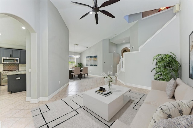 6423 Royal Tern Cir, Lakewood Ranch, FL 34202 - living room with arched walkways, high vaulted ceiling, ceiling fan, light tile patterned flooring, and recessed lighting