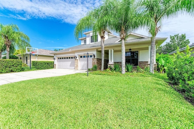 6423 Royal Tern Cir, Lakewood Ranch, FL 34202 - view of front facade with a front yard, concrete driveway, an attached garage, stucco siding, and a porch