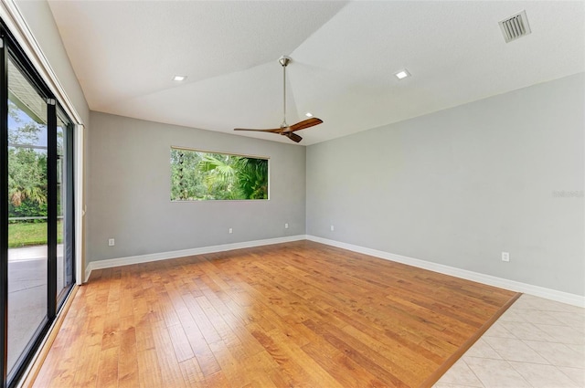 6423 Royal Tern Cir, Lakewood Ranch, FL 34202 - spare room with healthy amount of natural light, vaulted ceiling, ceiling fan, and light wood finished floors