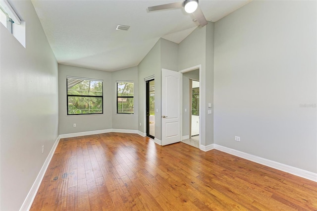 6423 Royal Tern Cir, Lakewood Ranch, FL 34202 - empty room featuring light wood-style floors, ceiling fan, and high vaulted ceiling