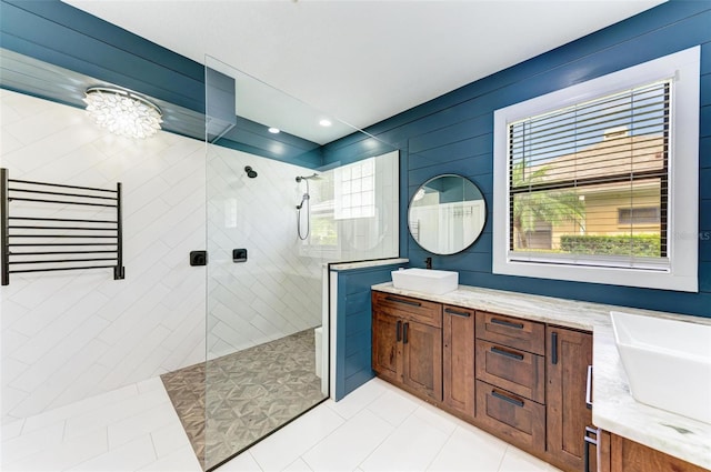 6423 Royal Tern Cir, Lakewood Ranch, FL 34202 - bathroom featuring double vanity, a walk in shower, healthy amount of natural light, and tile patterned flooring