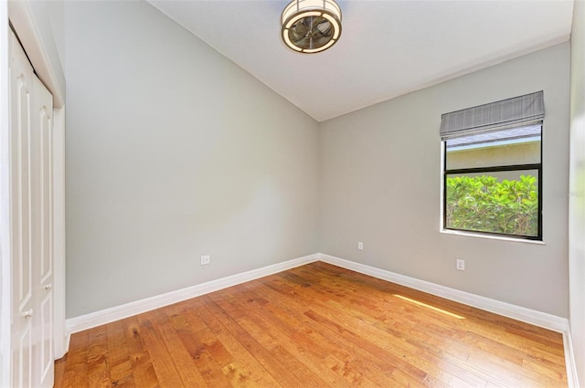 6423 Royal Tern Cir, Lakewood Ranch, FL 34202 - unfurnished room featuring light wood-style floors and vaulted ceiling