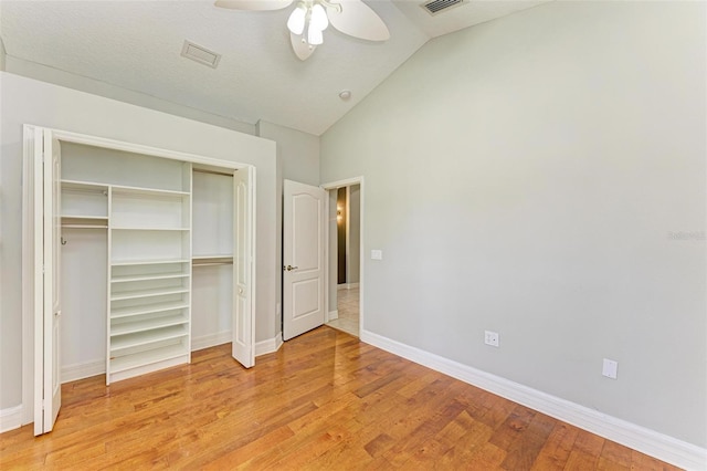 6423 Royal Tern Cir, Lakewood Ranch, FL 34202 - unfurnished bedroom with light wood finished floors, vaulted ceiling, a closet, and ceiling fan