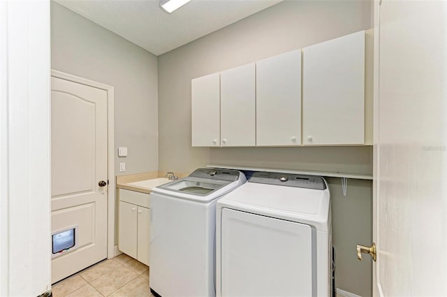 6423 Royal Tern Cir, Lakewood Ranch, FL 34202 - laundry room featuring cabinet space, washer and clothes dryer, and light tile patterned flooring
