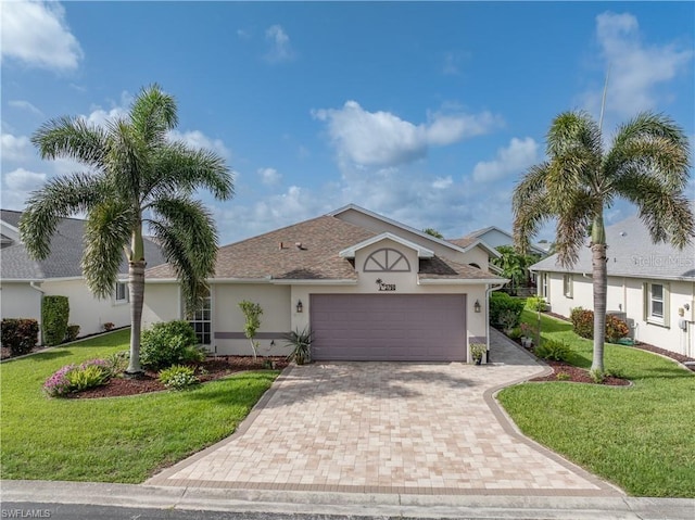 3760 Gloxinia Dr, North Fort Myers, FL 33917 - ranch-style house featuring stucco siding, a garage, decorative driveway, and a front lawn