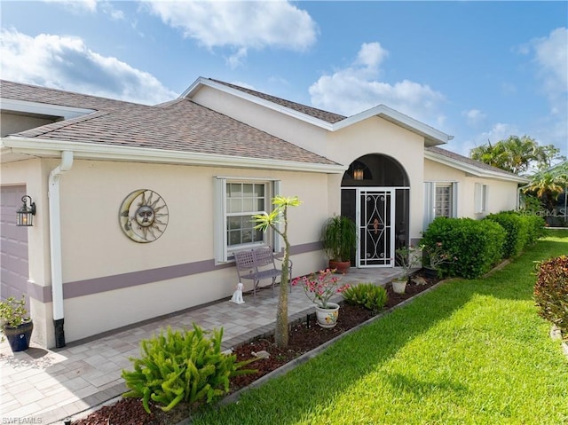 3760 Gloxinia Dr, North Fort Myers, FL 33917 - view of front of home featuring roof with shingles, stucco siding, and a front yard