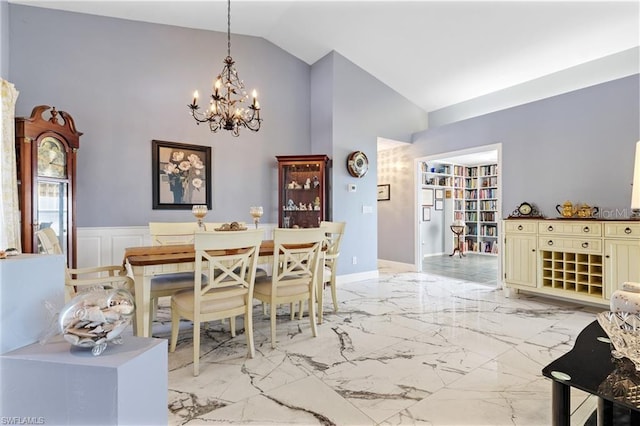 3760 Gloxinia Dr, North Fort Myers, FL 33917 - dining space with a chandelier, light marble finish flooring, and high vaulted ceiling