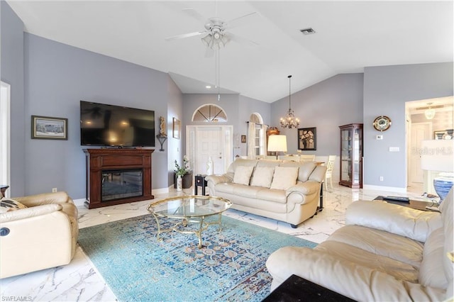 3760 Gloxinia Dr, North Fort Myers, FL 33917 - living room featuring light marble finish flooring, a ceiling fan, a glass covered fireplace, a chandelier, and high vaulted ceiling
