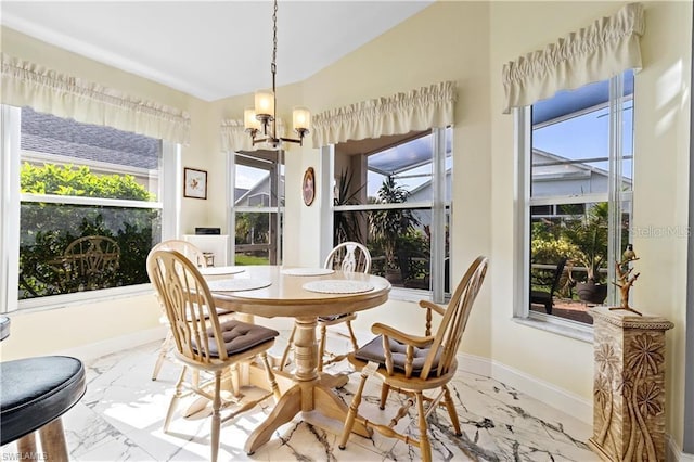 3760 Gloxinia Dr, North Fort Myers, FL 33917 - dining space featuring marble tiled flooring, a chandelier, vaulted ceiling, and baseboards
