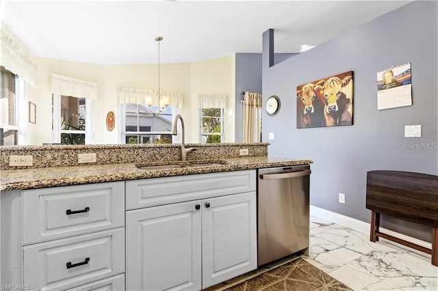 3760 Gloxinia Dr, North Fort Myers, FL 33917 - kitchen featuring dishwasher, a sink, marble finish floors, and white cabinets