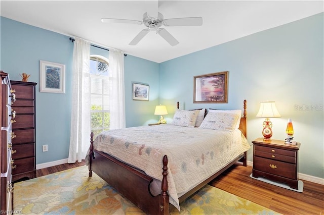 3760 Gloxinia Dr, North Fort Myers, FL 33917 - bedroom with baseboards, wood finished floors, and a ceiling fan