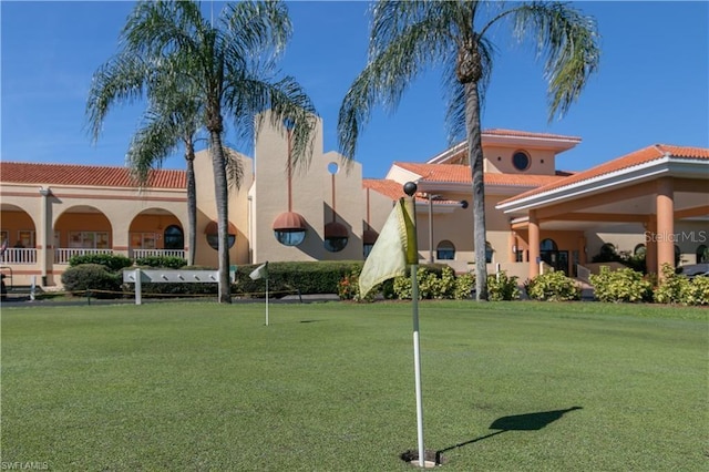 3760 Gloxinia Dr, North Fort Myers, FL 33917 - view of property's community with a putting area and a yard
