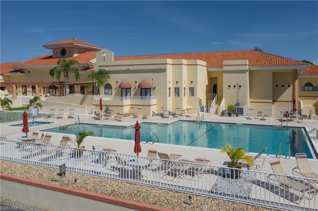 3760 Gloxinia Dr, North Fort Myers, FL 33917 - community pool featuring a patio area and a community hot tub