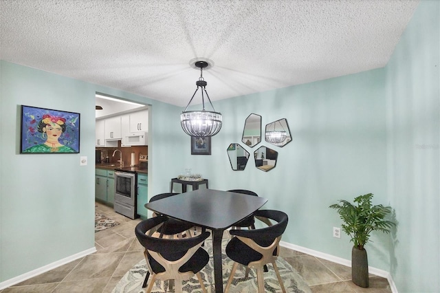 6832 Woodwind Dr Unit 53, Sarasota, FL 34231 - dining space with a chandelier, light tile patterned floors, and a textured ceiling