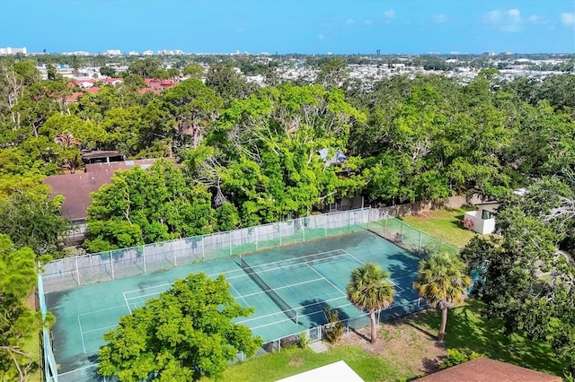 6832 Woodwind Dr Unit 53, Sarasota, FL 34231 - view of tennis court featuring view of scattered trees