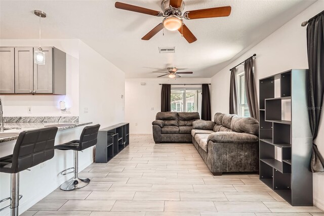 718 17th St E, Bradenton, FL 34208 - living area with a ceiling fan