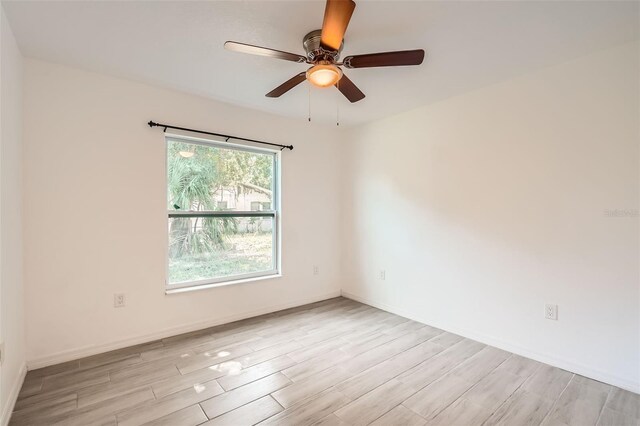 718 17th St E, Bradenton, FL 34208 - spare room featuring wood finished floors and ceiling fan