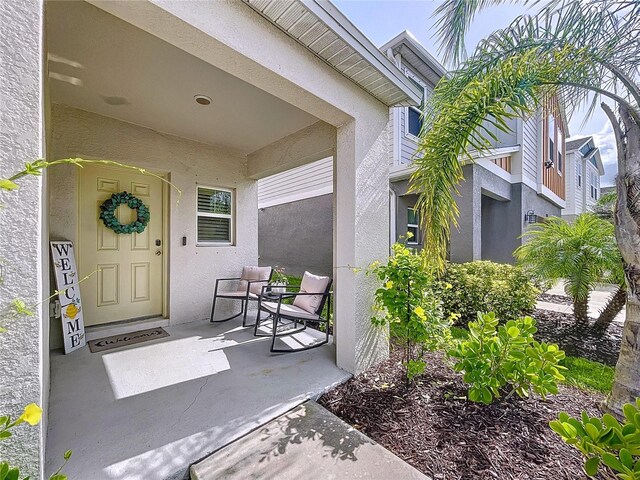 12832 Oak Hill Way, Parrish, FL 34219 - entrance to property featuring covered porch and stucco siding